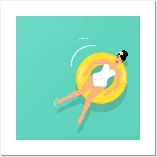 Woman sunbathing on floating rubber ring Posters and Art